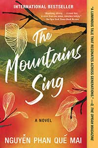 The book cover for The Mountains Sing has rich red, yellowish gold, and green coloring the sky and mountains. A tree with brown limbs and white drawn leaves are scattered over the whole cover.